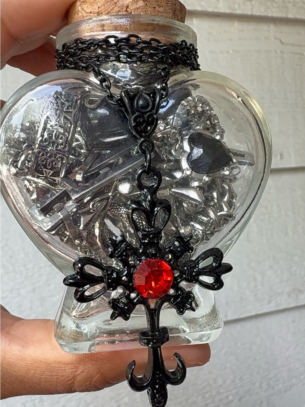 Black Cross Pendant Necklace with Red Gem Accent